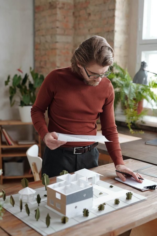 examining-architectural-sketch-in-office-1.jpg